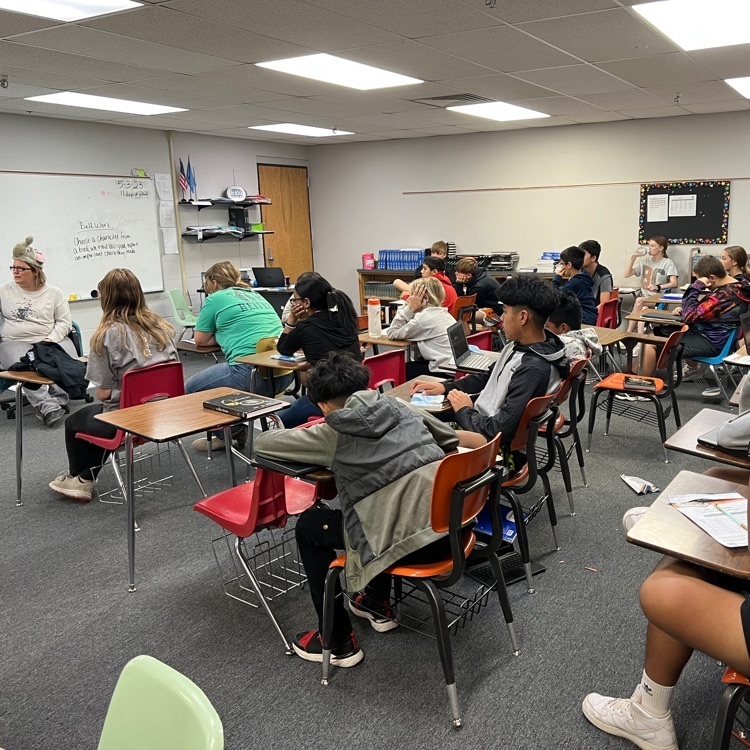 Mrs. Torres reads Horton has an Egg to 7th graders.